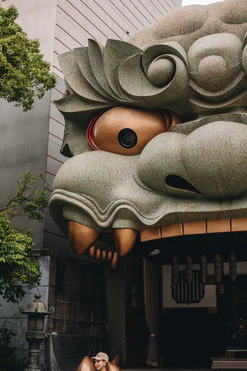 The giant stone lion head of a shrine in Osaka, close up