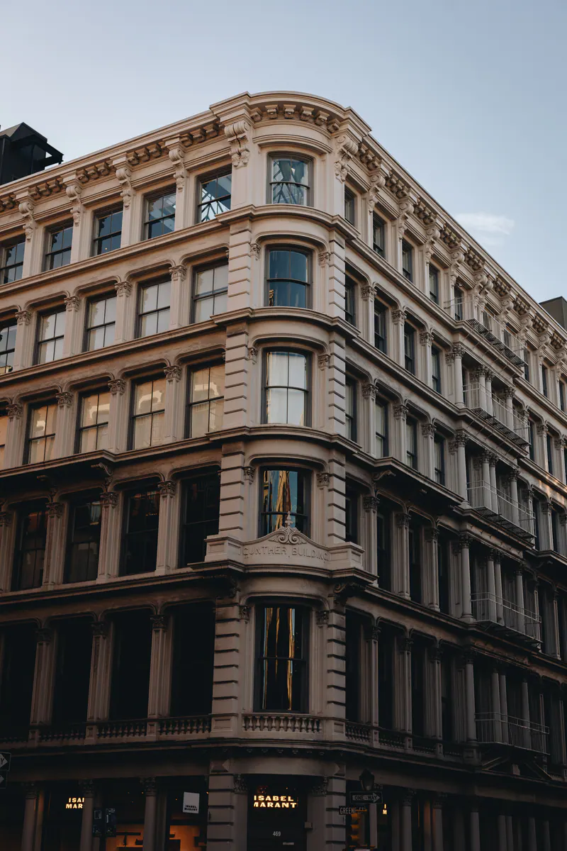 A cast-iron corner building in evening light